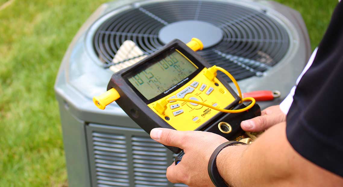 CoolSaver A/C Tune Up Program image - service provider testing A/C system